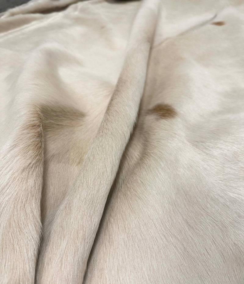 brown white cowhide rug
