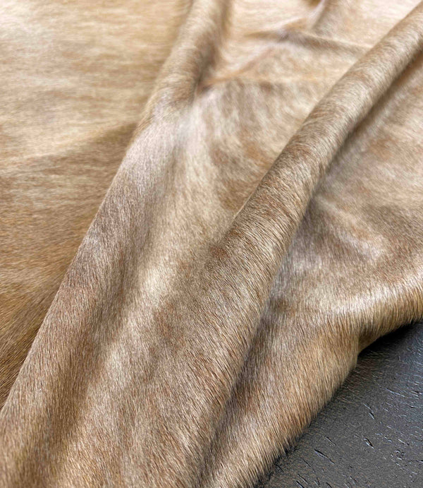 beige cowhide rug