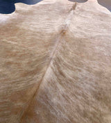 beige cowhide rug