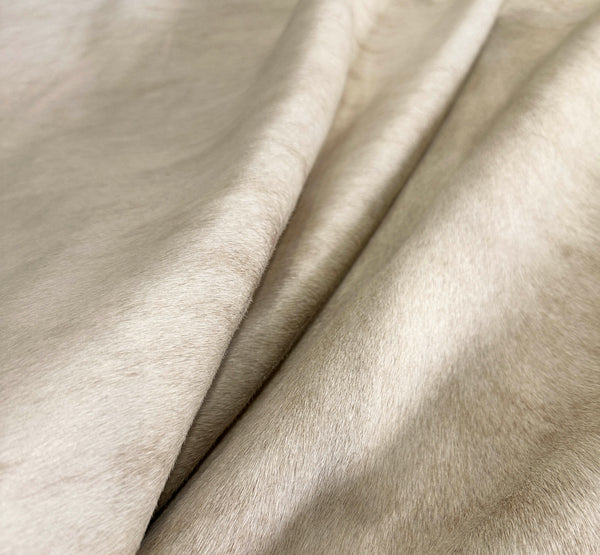 beige cowhide rug