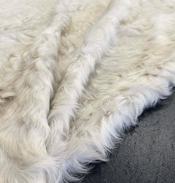 white cowhide rug