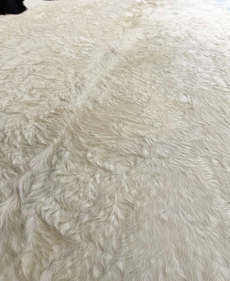 white cowhide rug