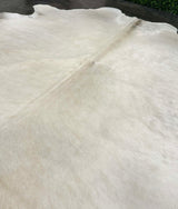 white cowhide rug