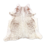 brown white cowhide rug